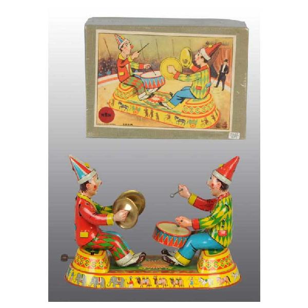Tin Clown Musicians Wind-Up Toy.: German. Working. Very hard-to-find toy when complete and in original box. Nice colorful lithography. When in operation, one clown plays the drum and the other the cymbals. Some scratching and wear. In
