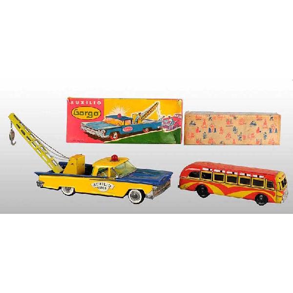 Lot of 2: Tin Foreign-Made Vehicle Toys.: Circa 1950s. Working. Includes one Portuguese wind-up Porto-Lizboa bus and one Argentinian friction wrecker truck. Very little wear overall. Includes both original boxes. Size: Largest: 12" L.
