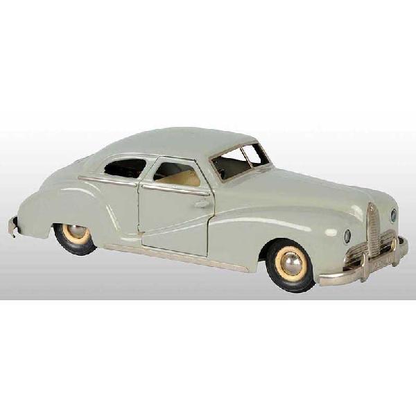 Tin JEP Delahaye Automobile Wind-Up Toy.: French. Circa 1950. Working. Marked "7585-JEP" on back and front and marked "JEP" on grille. Battery-operated headlights. When in operation, car moves forward and backward. A few small paint nicks thr