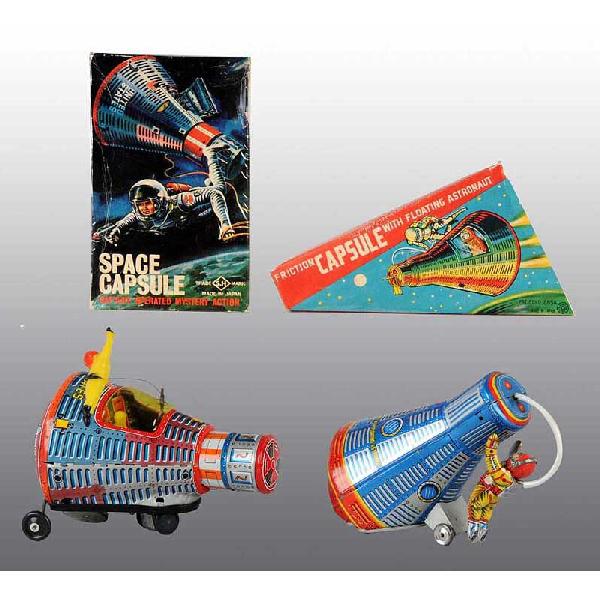 Lot of 2: Tin Space Capsule Toys.: Japanese. Working. Includes one battery-operated toy made by S.H. with vinyl figure and one friction toy made by Kanto with metal figure. Some scratching and wear. Includes both original boxes. Size: 
