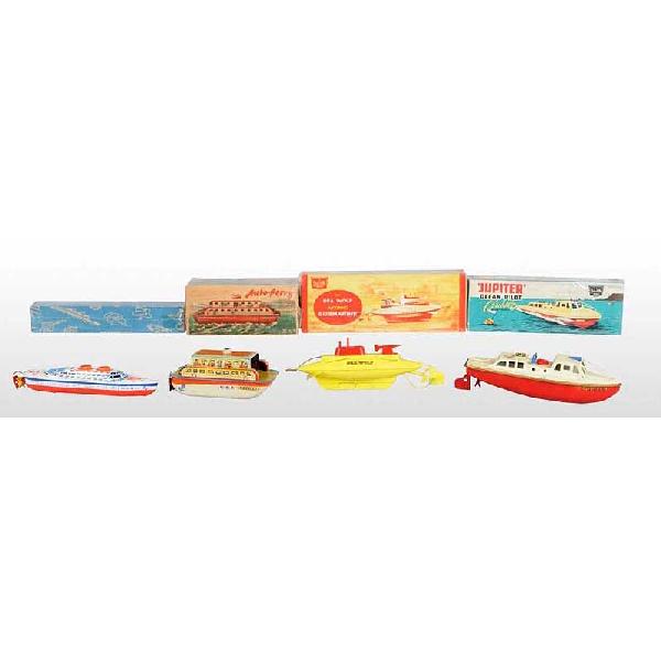 Lot of 4: Tin Boat Wind-Up Toys.: English and German. Working. Includes Sutcliffe Sea Wolf Submarine, Sutcliffe Jupiter Ocean Pilot boat, Neptun Ferry Boat, and one small Ocean Liner. Very little overall wear. Includes all original bo