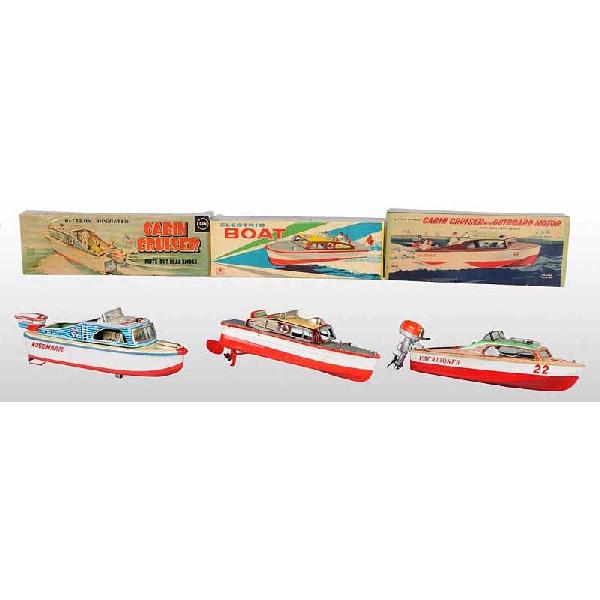 Lot of 3: Tin Pleasure Boat Battery-Operated Toy.: Japanese. Working. Includes three Cabin Cruisers, two with outboard motors. Marusan boat emits smoke from back when in operation. Slight wear to boats. Includes all original boxes with some slight sta