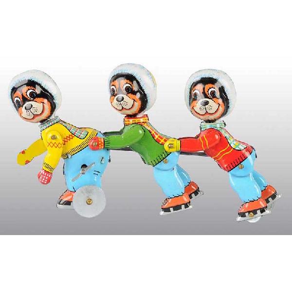 Tin TPS Skating Trio Wind-Up Toy.: Japanese. Working. Scarce toy with nice lithography. Some minor scratching and wear. Size: 9" L.
