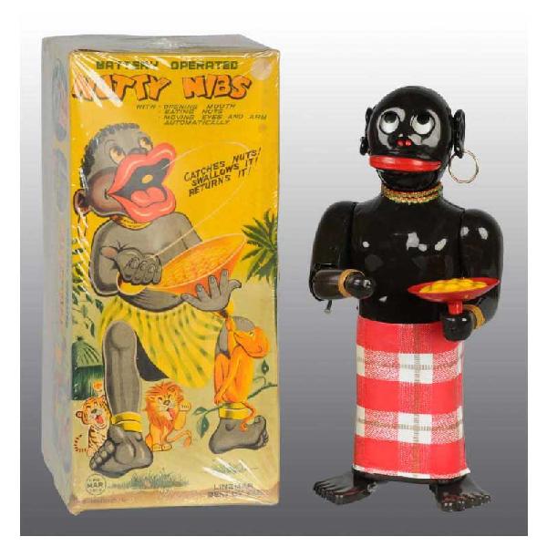 Tin Nutty Nibs Native Battery-Operated Toy.: Japanese. Working. Made by Linemar. Three original silver balls and original earrings. Original paper skirt is in excellent condition and the toy has little to no wear. Includes original box with some