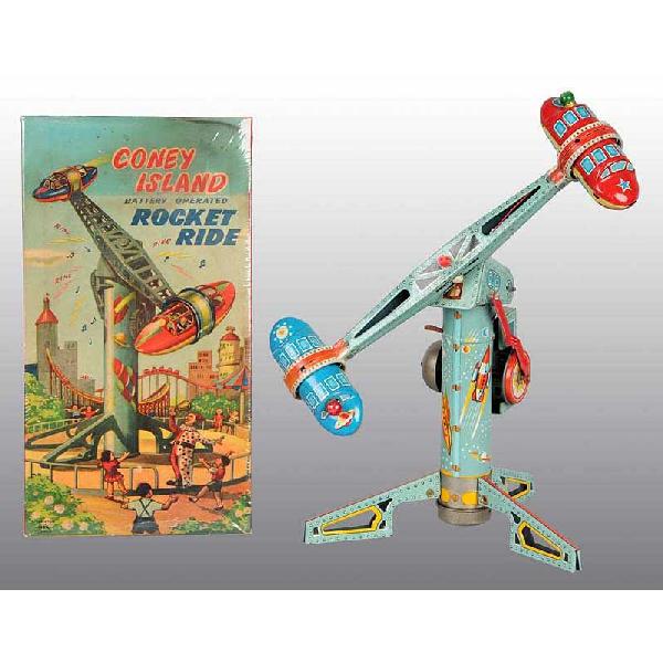 Tin Coney Island Rocket Ride Battery-Operated Toy: Japanese. Working. Made by Alps. Original rubber connector. Nice action toy with spinning carts and light-up bulbs. Very nice color graphics of space scenes around base. Minor scratching and wear to t