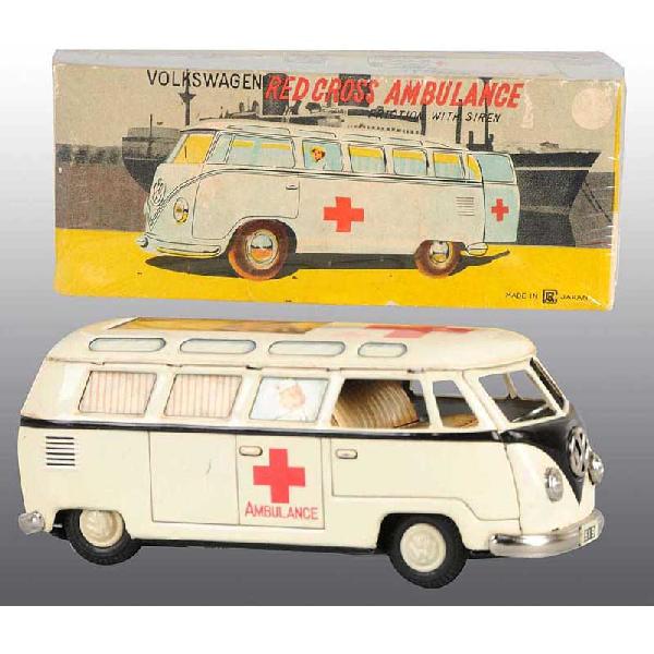 Tin Volkswagen Ambulance Friction Toy.: Japanese. Circa 1950s. Working. Made by Bandai. Volkswagen insignia on front of bus and Red Cross on roof and sides. A nurse is lithographed into two of the windows. Some minor scratching and wear. In