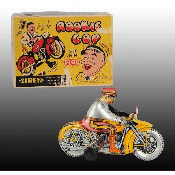 Tin Marx Rookie Cop Motorcycle Wind-Up Toy.: American. Working. Cycle has original headlight, very little scratching, and one side moderately faded. Includes original complete box with some tape residue, creasing, and slight paper loss. 8 - 1/4"