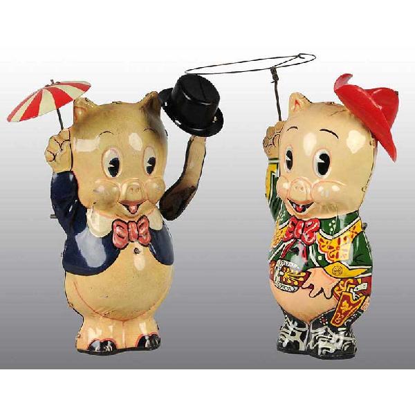 Lot of 2: Tin Marx Porky Pig Wind-Up Toys.: American. Working. Includes one cow puncher toy with original plastic hat and lasso marked "1949 Leon and Schlesinger" and "Cow Puncher Porky". Also includes one scarce moving arm top hat version mark