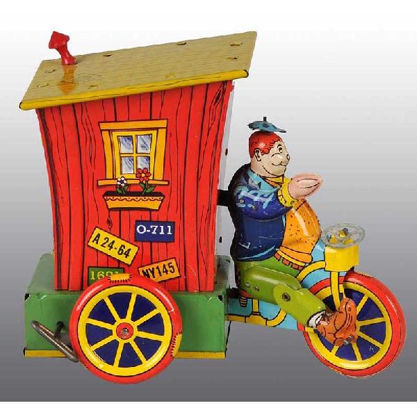 Tin Wyandotte Humphrey Mobile Wind-Up Toy.: American. Working. Original smoke stack. Some scratching and wear throughout. 7 - 1/4" x 8".