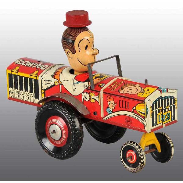 Tin Marx Dagwood The Driver Wind-Up Toy.: American. Working. Marked "King Features Syndicate Copyright 1935". Nicely lithographed characters from the Blondie comic strip around sides. Original wooden hat. Some minor scratching and wear. 8 - 1