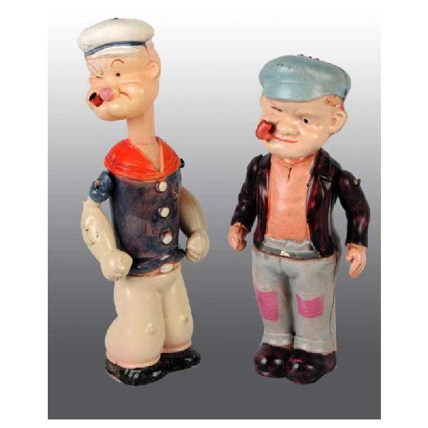 Lot of 2: Celluloid Popeye Wind-Up Figures.: Japanese. Pre-war. Both with original pipes. One is a Popeye with up and down neck and one unlicensed toy called the Rioter. Some denting to feet. Largest: 8 - 3/4" T.