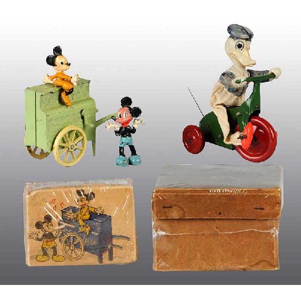Lot of 2: Tin Disney Mickey & Donald Duck Toys.: Includes one pre-war Japanese small Donald Duck tin cycle with celluloid figure. Probably made for the British market. Appears to be all original but missing rear cloth flag. Also includes one English