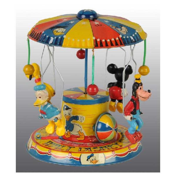 Tin Linemar Disney Character Carousel Wind-Up Toy: Japanese. Working. Nice color lithography shows four Disney characters and celluloid figures of Mickey Mouse, Donald Duck, Pluto, and Goofy. Donald's three nephews are lithographed around base. Pluto 