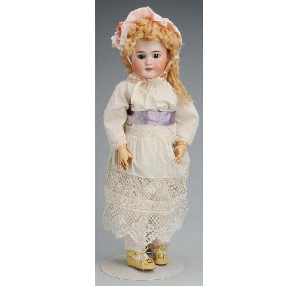 Jumeau French Bisque Bébé Doll.: DEP mark, blue sleeping eyes, molded eyebrows, pierced ears, open mouth with teeth, new mohair wig, jointed composition and wood French body (repainted). Size: 20" T.