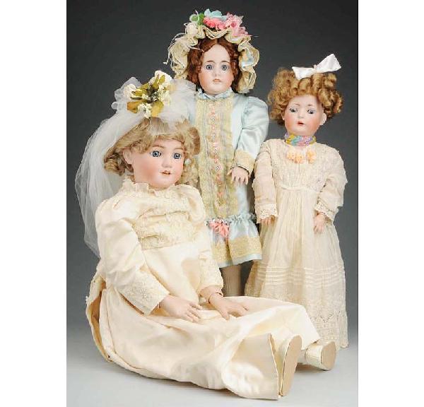 Lot of 3: German Bisque Child Dolls.: Bruno Schmidt incised BSW in heart, sleeping eyes, open mouth with teeth, new composition body; rare Kuhnlenz 88-33, paperweight eyes, open mouth with upper molded teeth, pierced ears, new composition