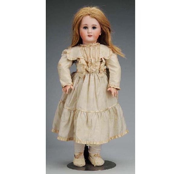 French Bisque Bébé Doll.: DEP (Jumeau), replaced eyes, molded eyebrows, open mouth with teeth, pierced ears, French jointed composition and wood body (repainted hands), cream sill dress looks vintage. Size: 24" T.