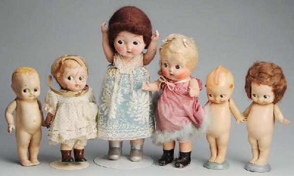 Lot of 6: American Composition Carnival Dolls.: Wigged Kewpie with O'Neill label; Kewpie (repair); 3 other wigged dolls, 1 all original; 1 bald. All have some crazing, cracking and wear. Size: Largest: 16" T.