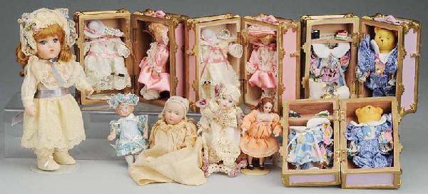 Lot of Small Artist Dolls.: 2 bisque head dolls in trunks with wardrobes, 2 bears in trunks with wardrobes; Heubach Stuart baby on old composition body; doll house doll with glass eyes; 2 all-bisques with glass eyes; 1 antique a