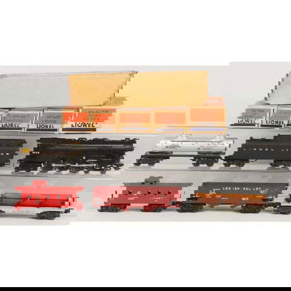 Lionel No. 2055 Freight Train Set.: O27 gauge. Includes 2055 steam engine with 6026 whistle tender, 6456 hopper car, 6411 flat car, 6465 tank car, and 6257 caboose. Includes all individual boxes and engine with box insert only. Size: