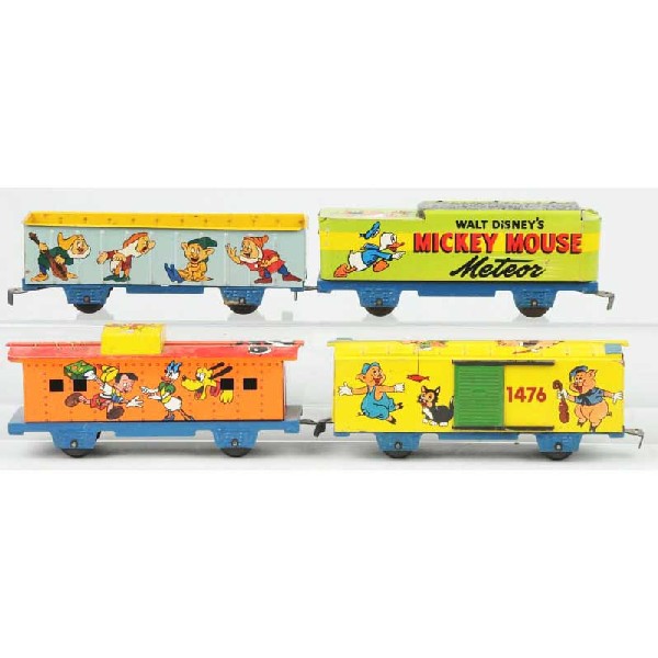Marx Walt Disney Mickey Mouse Meteor Train Set: American. Includes tender, gondola car, scarce Three Little Pigs boxcar, and tender. All with nicely lithographed Disney characters. Missing engine. Moderate scratching and wear. Size: Largest: 8" L.