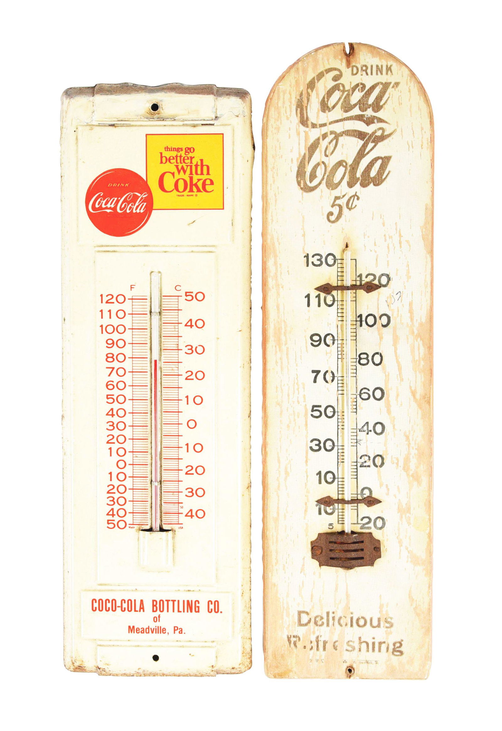LOT OF 2: COCA-COLA THERMOMETERS.: The first is a painted metal "Things Go Better with Coke" version with edge wear, paint loss, some slight color fade, but does have an intact and working tube. The second is a wooden Coca-Cola 5¢