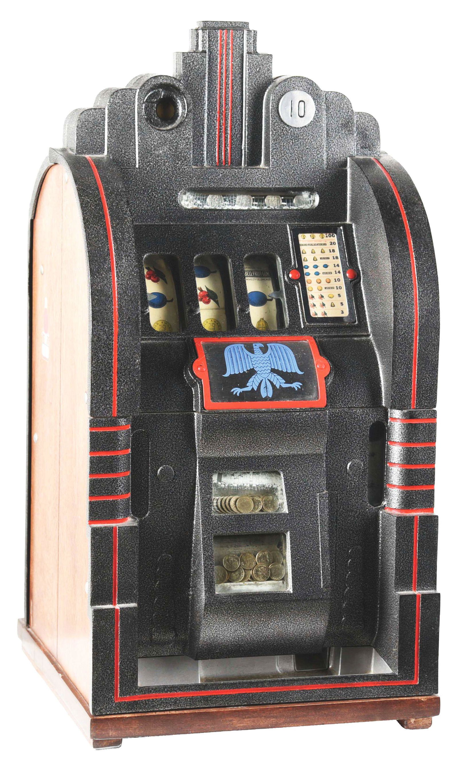 10¢ MILLS NOVELTY CO. EXTRAORDINARY SILENT SLOT: An Art Deco slot machine, designed to commemorate the 1933 Chicago World's Fair, manufactured by Mills Novelty Co. in 1933. The front casting is restored hammer tone grey paint with an eagle emblem at