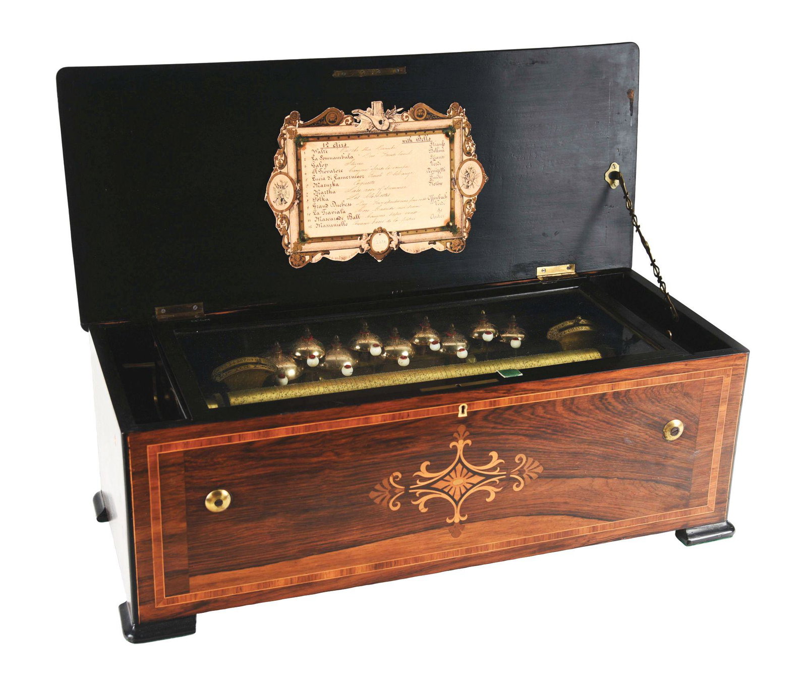 BEAUTIFUL BRAZILIAN ROSEWOOD INLAY MUSIC BOX.: This is a beautiful rosewood inlay cylindered music box with a 16" cylinder playing bells. Unknown maker, marked "CPC" with a 12 Aiars tune card, in all original condition. There are slight areas of w