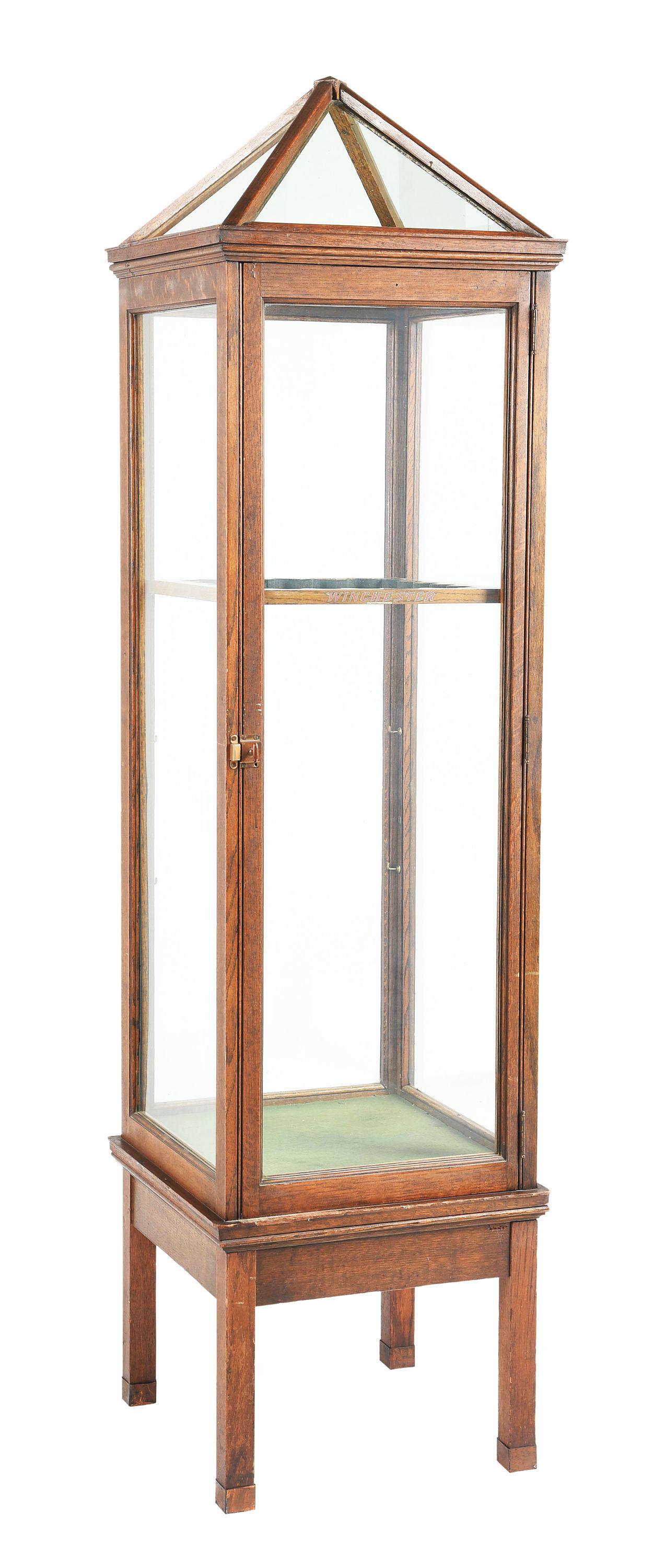 VERY RARE WINCHESTER GLASS RIFLE CABINET.: Very rare example of the 1920s marketing cabinet that was offered to Winchester Premier dealers. 4-sided glass case with pyramid top, with quarter-sawn oak frame. Nominal measurements are 5/8" frame t