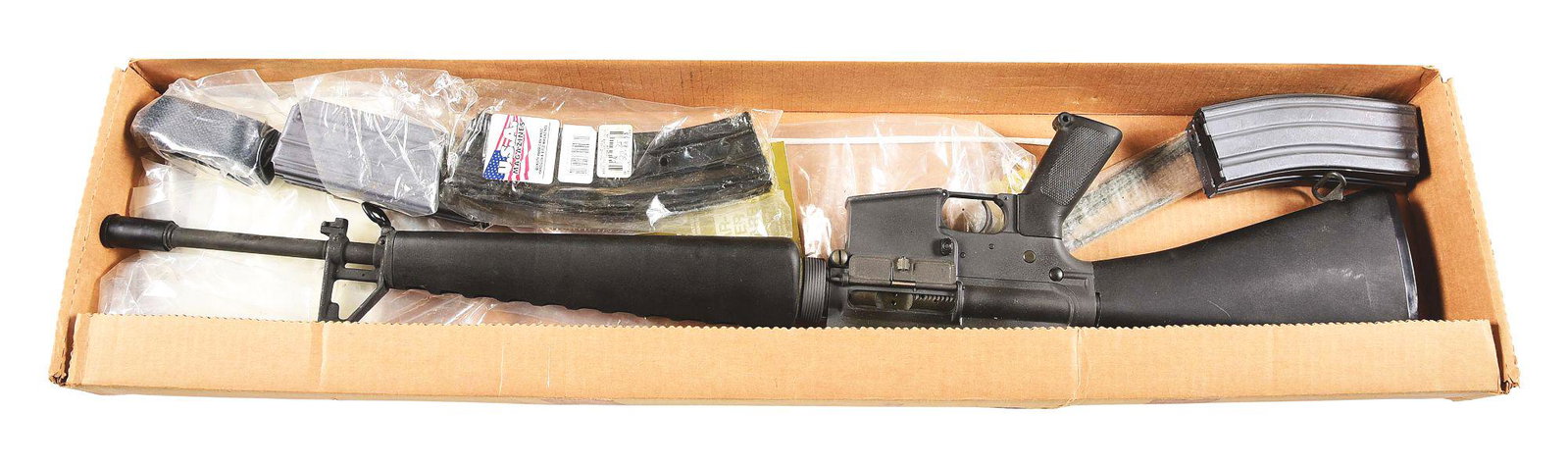 (M) PRE-BAN COLT MODEL SP1 AR-15 SEMI-AUTOMATIC RIFLE: Pre-Ban Colt Model SP1 semi-automatic rifle with box and accessories. Made 1982. Classic A1 flash hider, bayonet lug, and no forward assist. Left side of the receiver is marked with the Colt pony logo