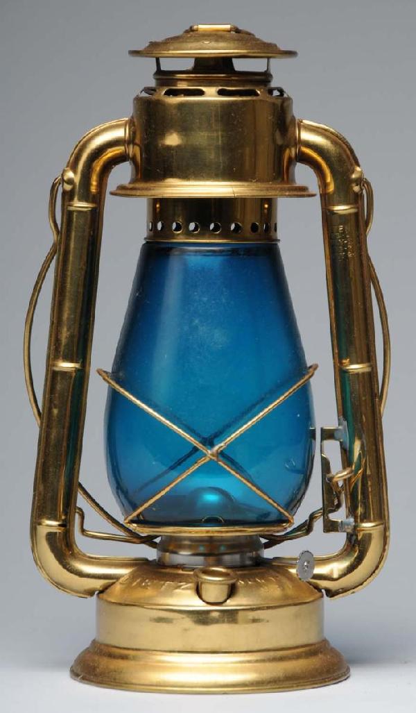 Railroad Lantern.: With medium aqua blue glass shade. Marked "Dietz" and embossed "Junior". Size: 12" T.