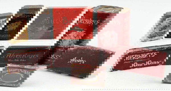 Lot of 8: Hershey Product Containers.: Most are cardboard and depict early Hershey Cocoa tins and cans while one is for Wilbur Buds. Lot also includes one set of silver coins from Hershey. Size: Largest: 6 - 3/4" T.