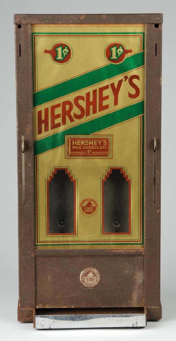 Hershey's 1-Cent Chocolate Vending Machine.: Rare. Made by the Shipman Company. Metal with glass front. All original. Top comes off to refill with candy. Size: 19 - 1/4" T.