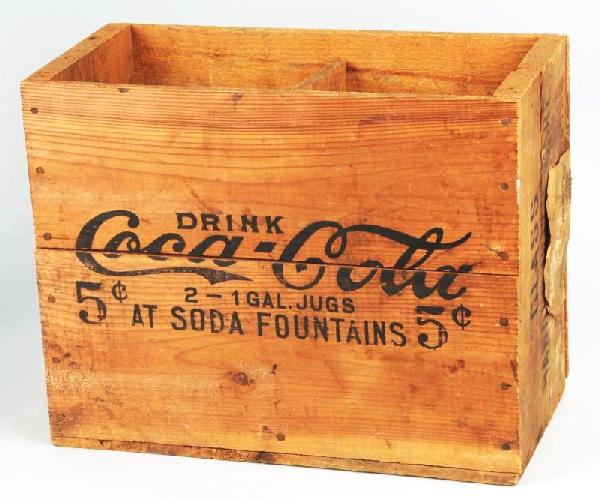 Early Wooden Coca-Cola 2-Jug Crate.: Description 1910 to 1920s. Held two one-gallon jugs. Nice, clean, and bright with strong stenciling remaining on both sides. Condition (Excellent Plus). Size 12 - 1/2" x 15 - 3/4" x 7 - 1/2".