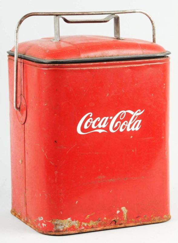 Coca-Cola Picnic Cooler.: Description 1940s to 1950s. Coca-Cola lettering is in vinyl and not original. Overall wear and rust to bottom. Condition (Good). Size 15" x 10 - 1/2" x 9".