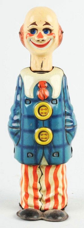Tin Distler Clown Wind-Up Toy.: Description German. Working. Marked "US Zone Germany" on back. When in operation, clown's head goes up and down and eyes move. Some slight scratching and wear. Condition (Very Good). Size 6 - 1/4" T.