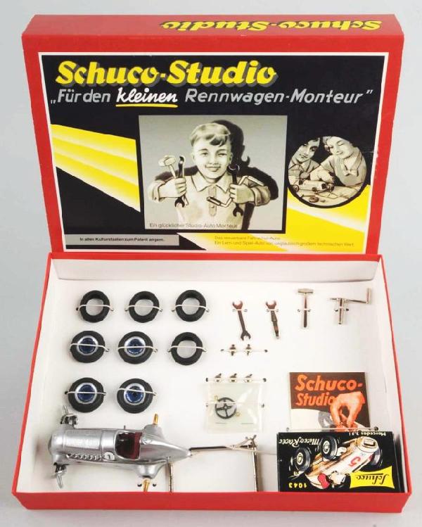 Contemporary Schuco Studio Micro Racer Car Set.: Description German. Working. Includes no. 1043 micro racer in original box, no. 1 Mercedes racer, and several wheels, wrenches, and other tools. Unused. Includes original box, box sleeve, and instruct