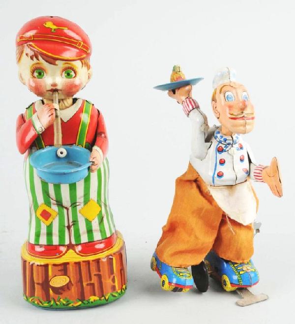 Lot of 2: Tin Character Wind-Up Toys.: Description Japanese. Working. Includes one Marusan Bubble Blowing Boy with some tin litho loss to bowl and one TPS Skating Chef with original pants and some soiling to back. Condition (Very Good). Si