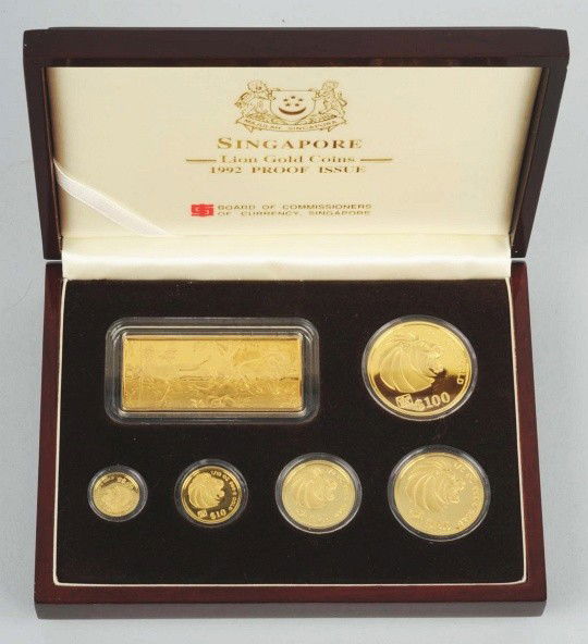 Singapore Coin Collection.: Description 1992 proof condition gold set. 1 gold plated Ingot silver bar and 5 gold coins. Coins weigh 1 ounce, 1/2 ounce, ¼ ounce, 1/10 ounce, 1/20 ounce.