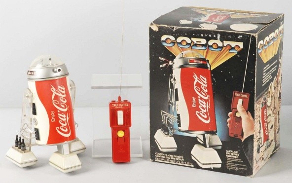 Vintage Coca-Cola Robot Battery-Operated Toy.: Circa 1977. Scarce and unused. Made to look like R2-D2 and was taken off the market. Includes original box marked "Cobot" and insert. Size: Box: 11 " T.