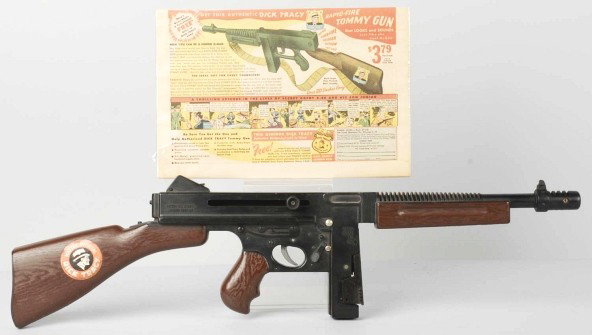 Vintage Dick Tracy Thompson Machine Gun Toy.: Made by Mattel. Dick Tracy decal on stock of gun. Includes color ad from magazine for toy, which originally sold for $3.79. Size: 25" L.