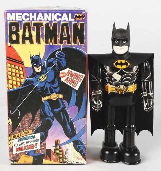 Tin Batman Wind-Up Toy.: Japanese. Circa 1989. Made by Biliken. Unused. Includes original box and insert. Size: 9" T.
