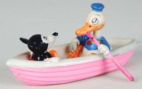 Celluloid Walt Disney Mickey & Donald Boat Toy.: Japanese. Pre-war. Marked "Walt. E. Disney" on side of boat and "Made in Japan" on bottom. Beautiful, bright, and all original condition. One repair to Donald's neck. Size: 5 - 3/4" L.