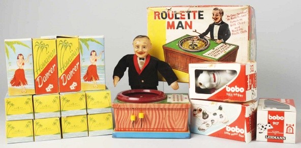 Lot of Miscellaneous Toys.: Includes one Roulette Man made by J.F., ten plastic Hawaiian dancers made in Italy, and three plastic Lehmann Bo Bo dog toys. Includes all original boxes. Size: