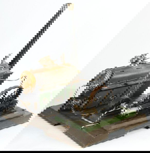 Marklin No. 4146/9 Horizontal Engine with Dynamo.: Circa 1928. This fine engine includes a partially jacketed boiler, a water glass, a drain cock, a feed water pump, a weighted safety, a whistle, oilers and the dynamo. It has a cat walk around the boi