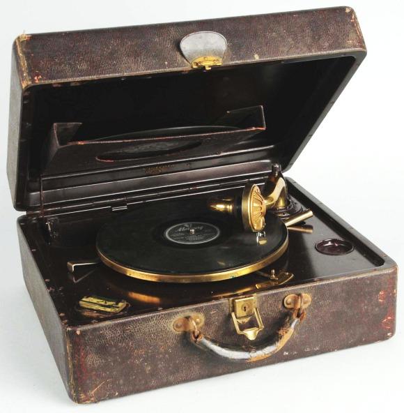 Victrola Phonograph in Portable Case.: Beautiful brass arm. Crank mechanism plays well. Includes two 78 records. Size: