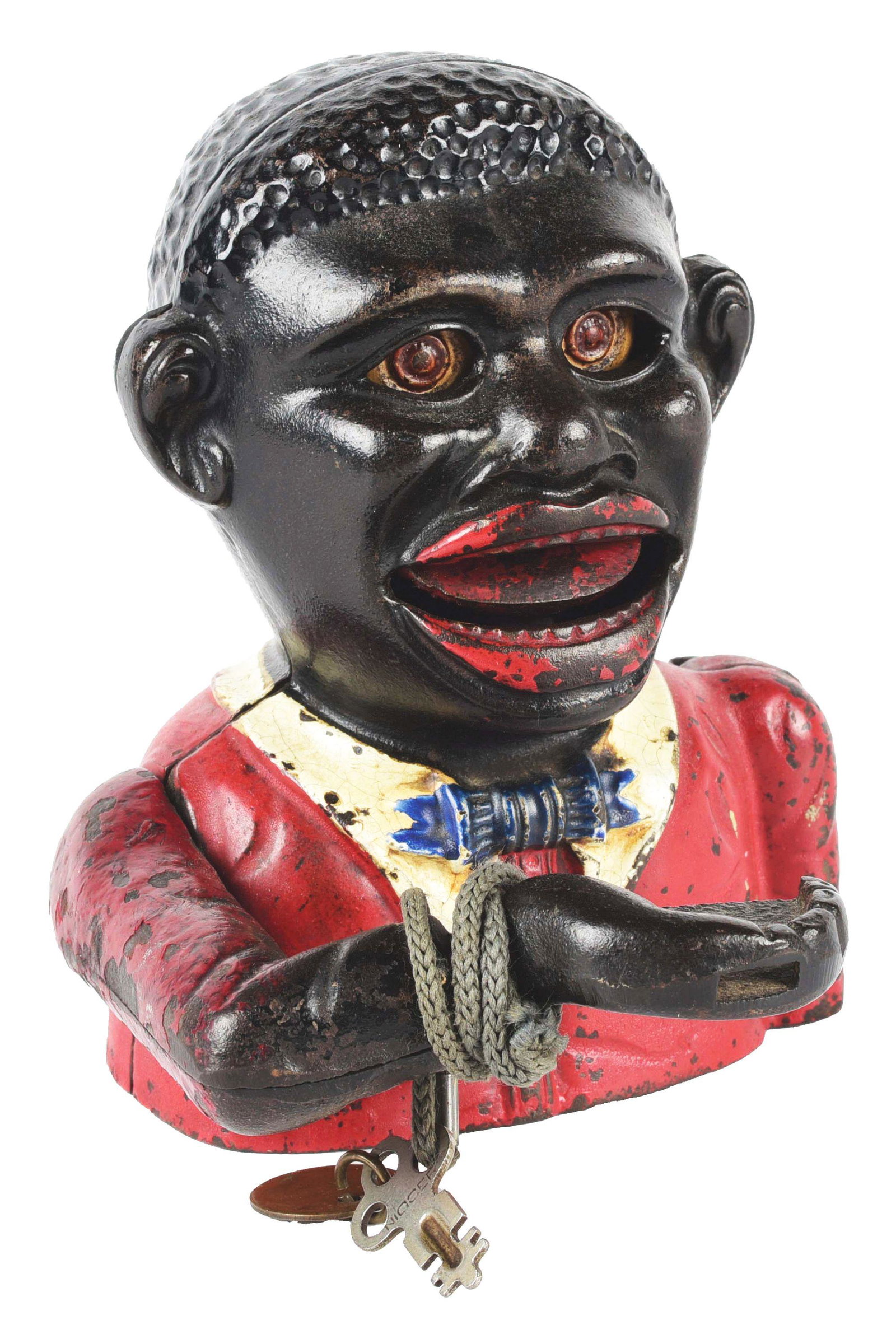 LITTLE JOE CAST IRON MECHANICAL BANK.: This Little Joe mechanical bank by John Harper has a locking baseplate with key and an original arm taken from another bank. Condition: (Very Good). Dimensions: 4 - 3/4" x 4 - 1/4" x 5 - 1/4".