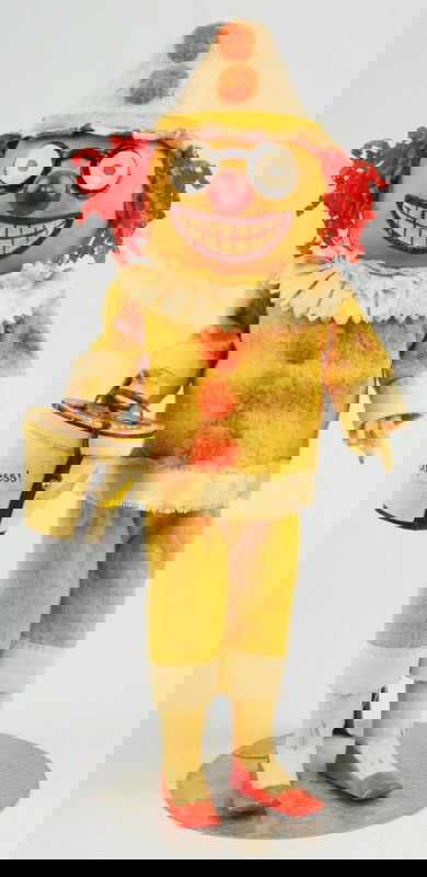 Figural Halloween Jack-O-Lantern Candy Container.: A very unusual Halloween item featuring a red glass nose, a huge watermelon grin, and with a cylindrical candy container in body (torso). Dressed as a clown with red crape paper hair extending from ca