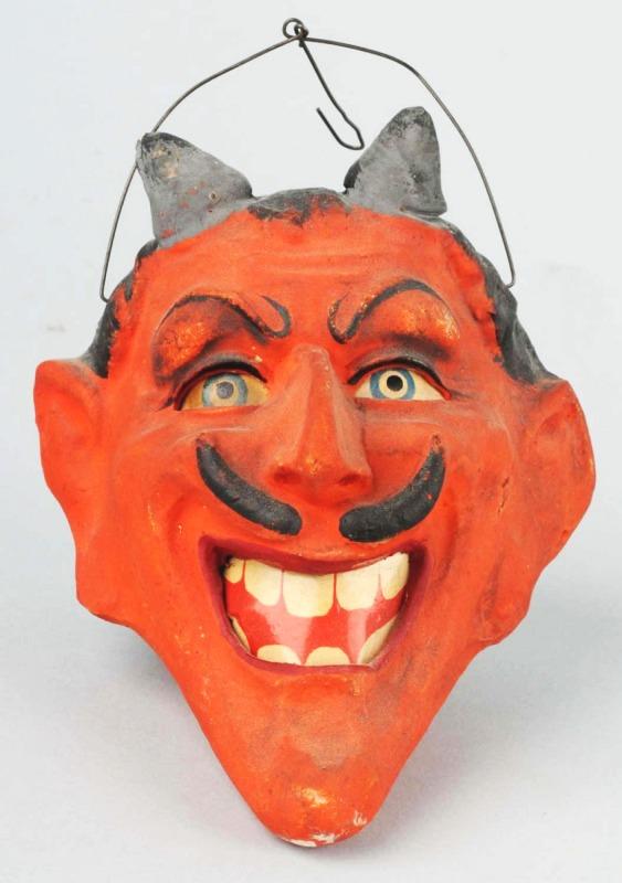 Large Devil's Head Halloween Lantern.: Unusually large size with extreme molding including devils horns, molded eyebrows, and typical devil features such as protruding chin, hook nose, and molded handlebar mustache. Size: 3 - 1/2" T.