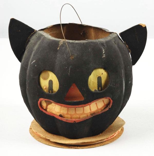 Paper Mache Cat Jack-O-Lantern with Pointed Ears.: German. Rare. Two jack-o-lanterns in one. Annealed ears. One sizeable burn hole to lantern and some slight separation of the ears. Size: 5 - 1/2" W.