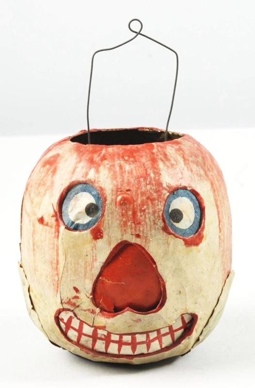 Unusual Strawberry Jack-O-Lantern.: Original paper inserts, candle holder, metal handle, and leaves at bottom. Size: 4 - 1/4" T.